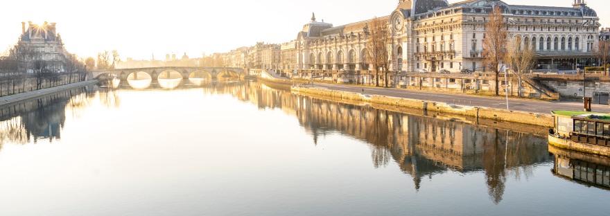 Paris, France: Musée d'Orsay reflecting in the Seine river at sunrise